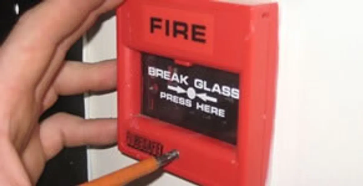 fire alarm installation service showing manual fire alarm pull station installed by licensed electricians in Arlington, TX