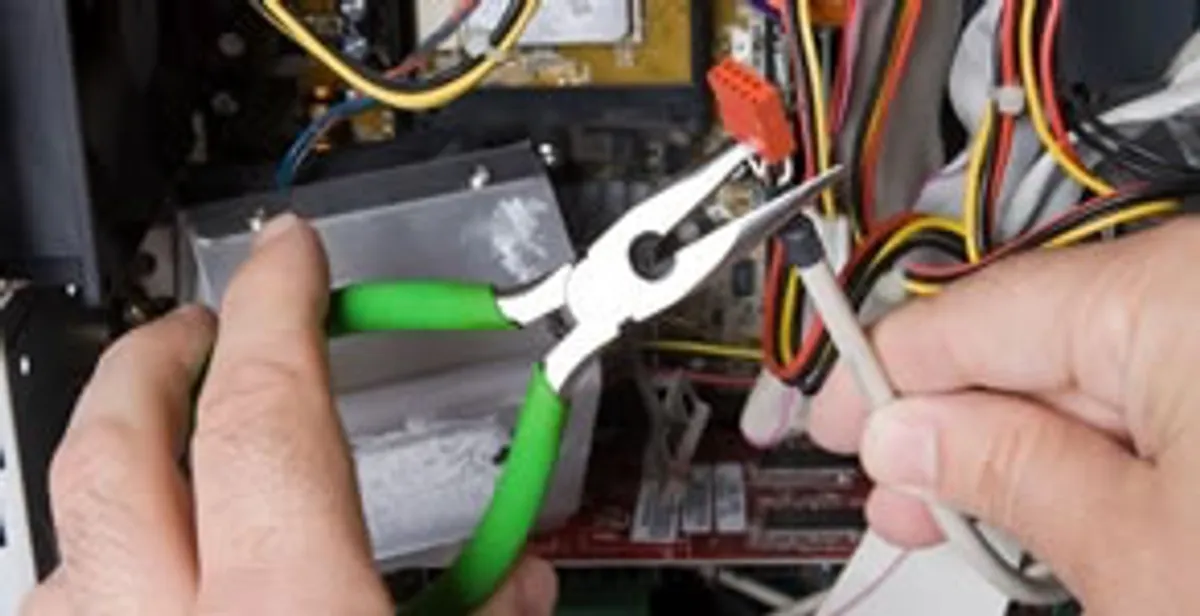 Licensed electrical contractor performing electrical repair with tools in Cedar Hill, TX