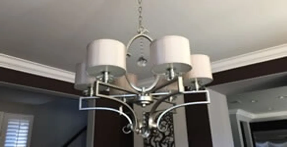 Modern chandelier installation with multiple light fixtures in Arlington, TX